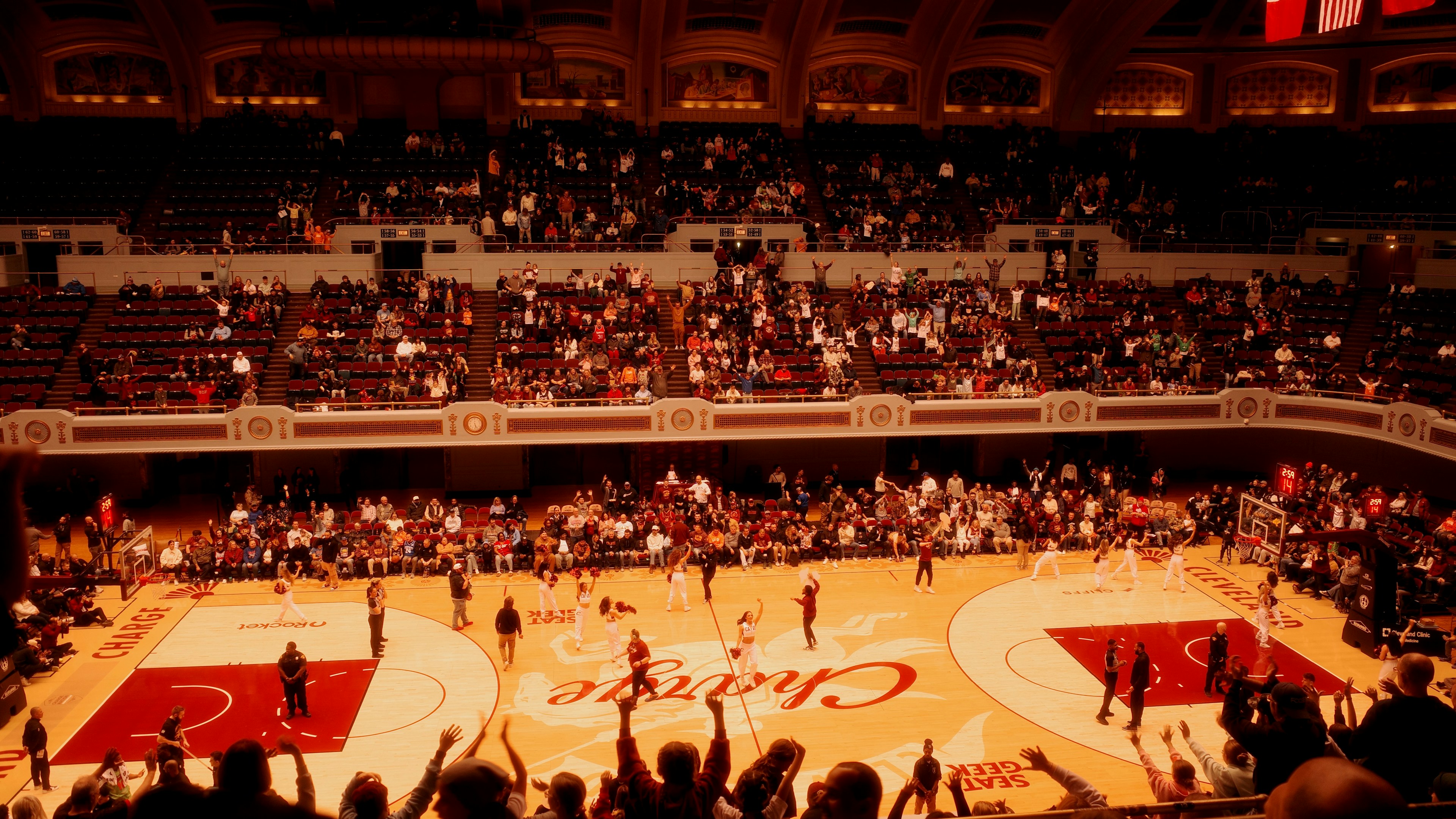 A real basketball arena with spectators watching from the stands